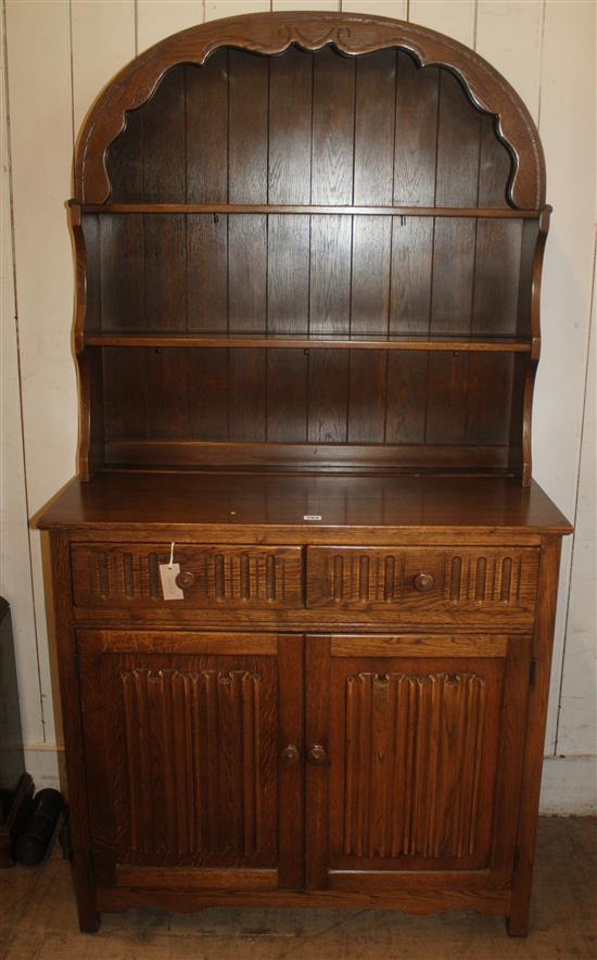 Reproduction oak domed top dresser fitted two linenfold panel doors